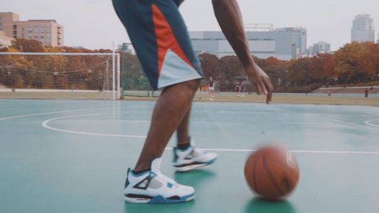 Man Playing Basketball