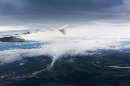 Airplane Above Clouds