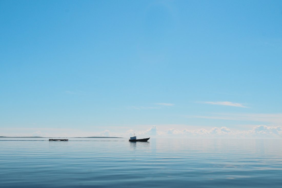 Free stock image of Boat on Calm Blue Lake
