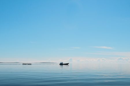 Boat on Calm Blue Lake