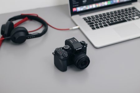 DSLR Camera, MacBook and Headphones
