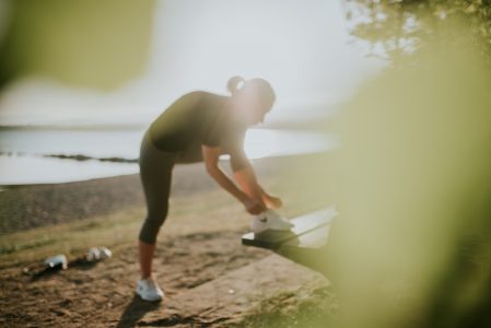 Woman Stretching on Bench