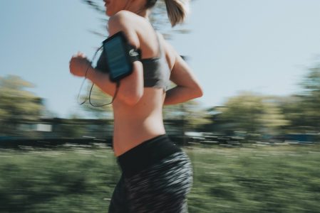 Woman Running with Mobile Phone