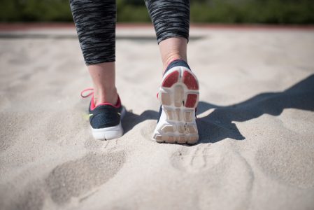 Sporty Woman Walking On Sand