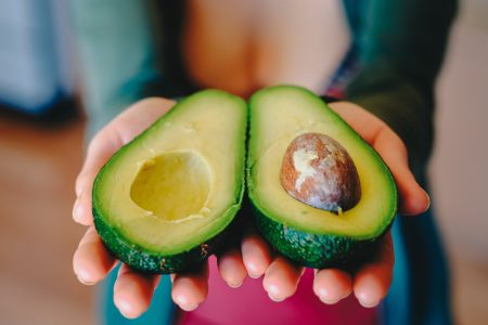 Woman Holding Avocados