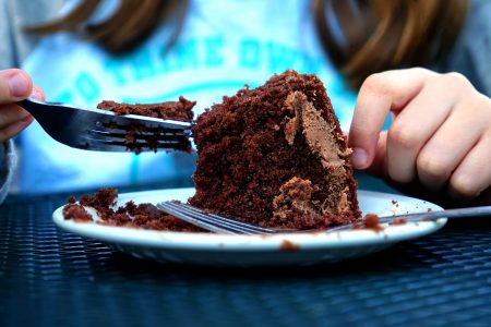 Person Eating Cake