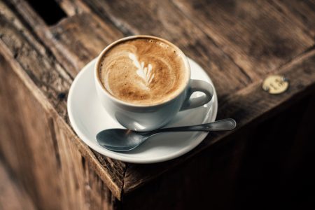 Cappuccino Coffee on Rustic Wooden Table
