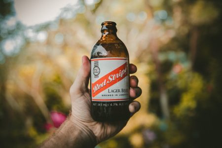 Man Holding Beer Bottle