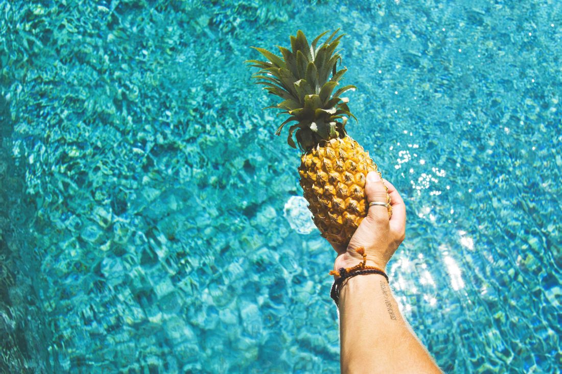 Free stock image of Man Holding Pineapple