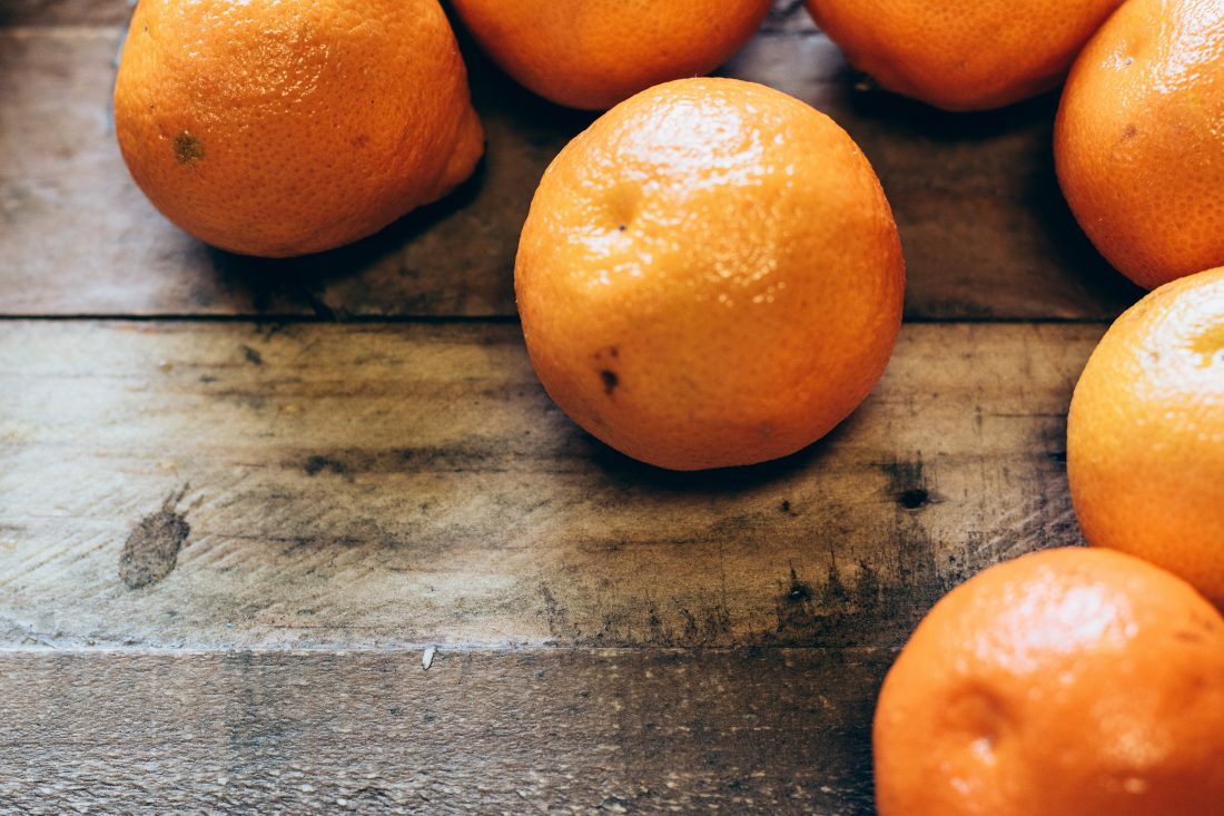 Free stock image of Oranges on Wood Table