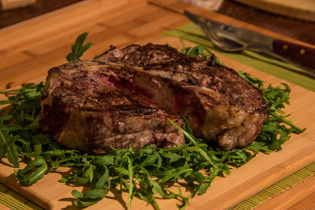 Free stock image of Juicy Rib Steak on Wooden Table
