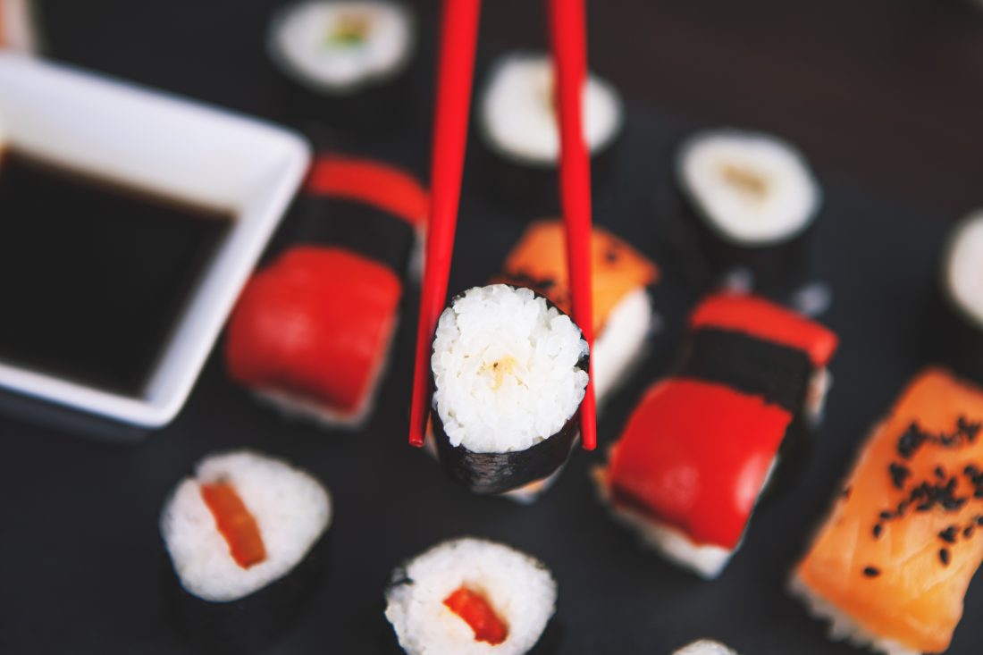 Free stock image of Sushi Held in Chopsticks