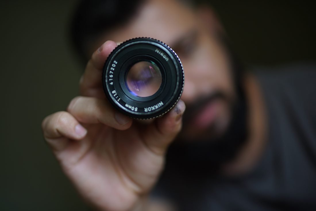 Free stock image of Photographer Holding Lens