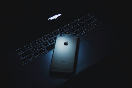 Dark MacBook and iPhone