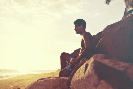 Man Relaxing At Beach