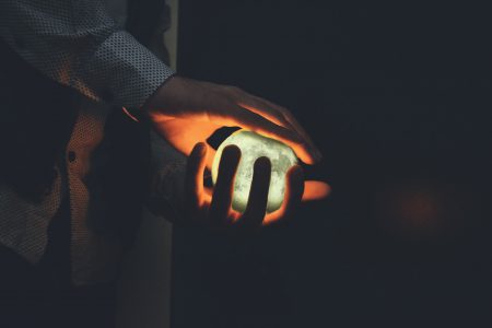 Man Holding Glowing Orb