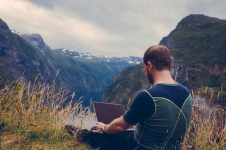 Man Using Laptop Outdoors