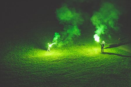People Holding Flares