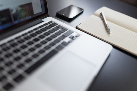 Laptop & Notepad on Desk