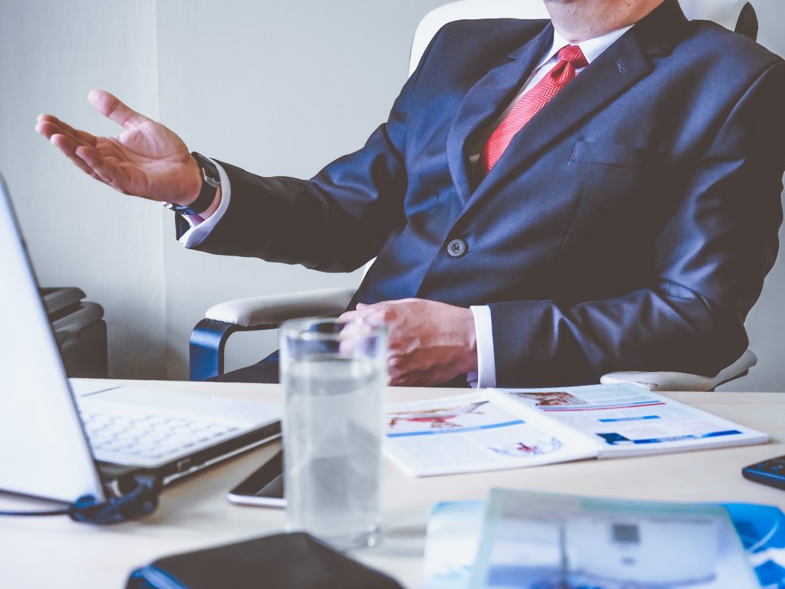 Talking at Desk Royalty-Free Stock Photo