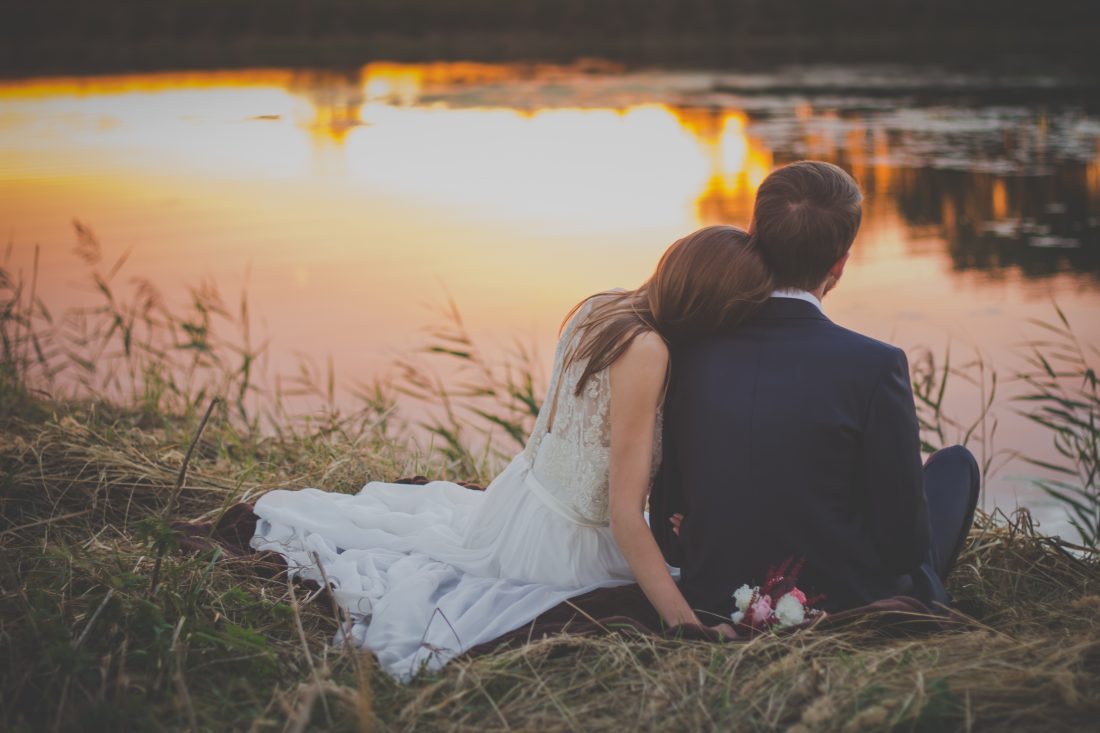 Free stock image of Wedding Couple on Grass at Sunset
