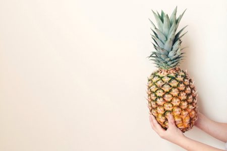 Holding Pineapple