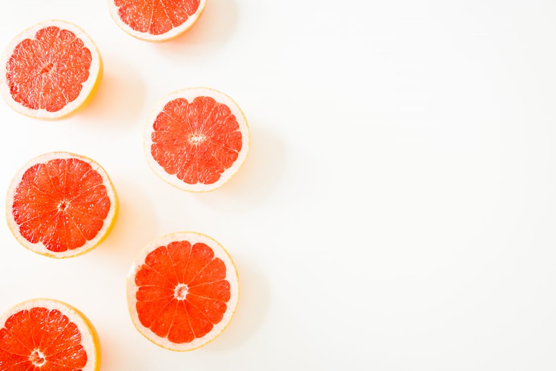 Free stock image of Sliced Tangerine on White Background