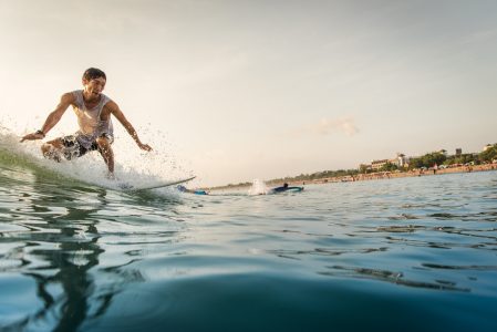 Surfer Riding the Wave