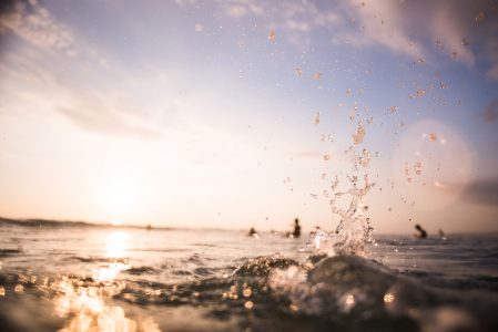 Surfers Splashing Water Waves