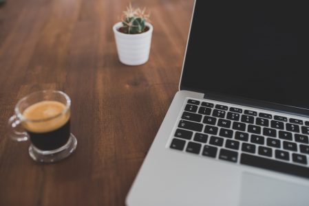 Computer on Office Desk with Coffee