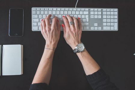 Woman Typing on Computer