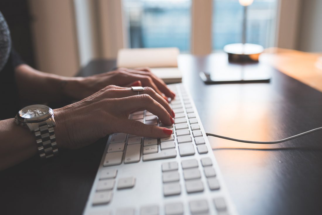 Free stock image of Woman Typing on Computer Keyboard