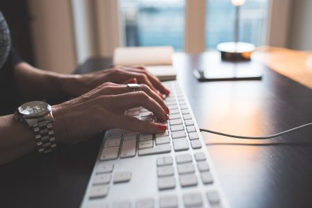 Woman Typing on Computer Keyboard