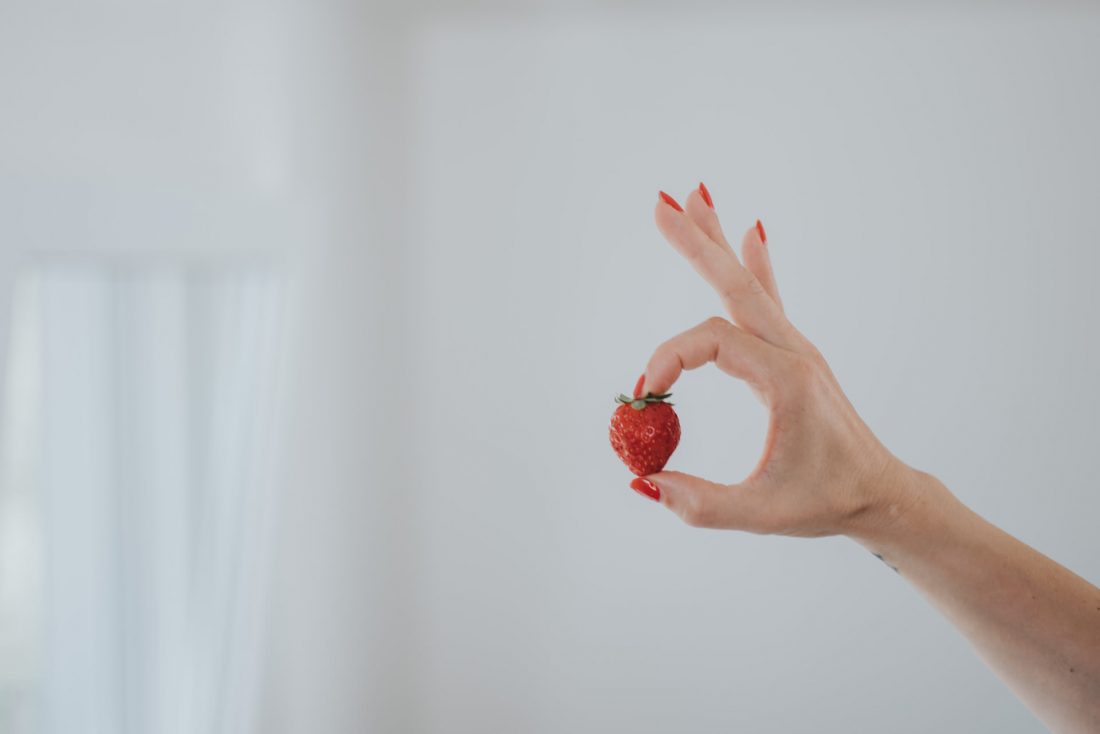 Free stock image of Woman Holding a Strawberry