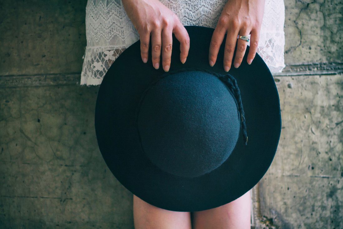 Free stock image of Woman Holding Hat