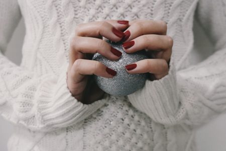 Woman Holding Christmas Ball