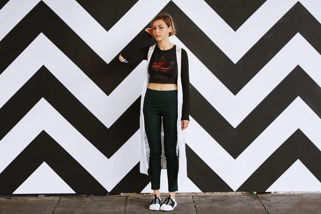 Free stock image of Woman by Patterned Wall