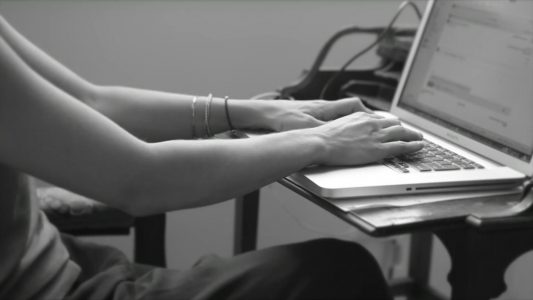 Woman Typing on Keyboard