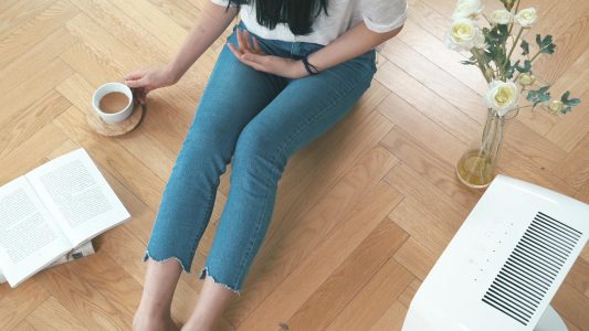 Woman Sitting on Floor