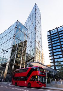 Red Bus and Skyscraper