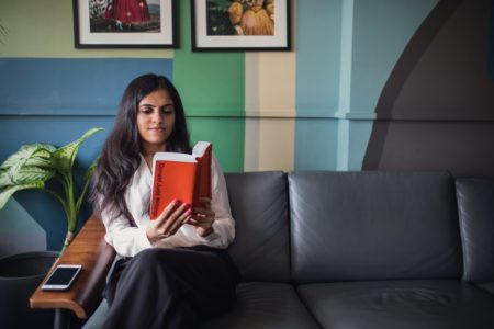 Woman Reading on Couch