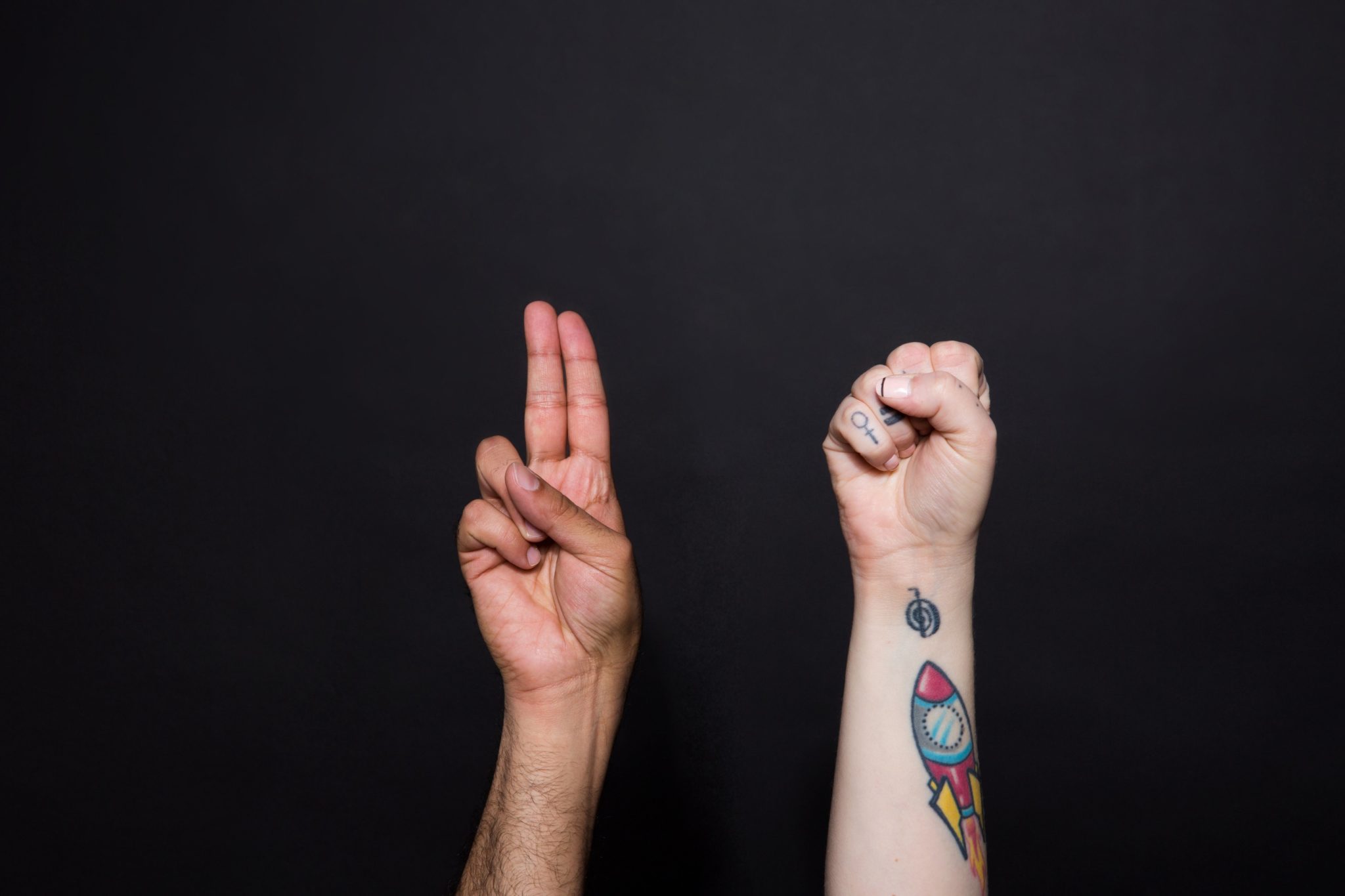 hands on top of each other sign language
