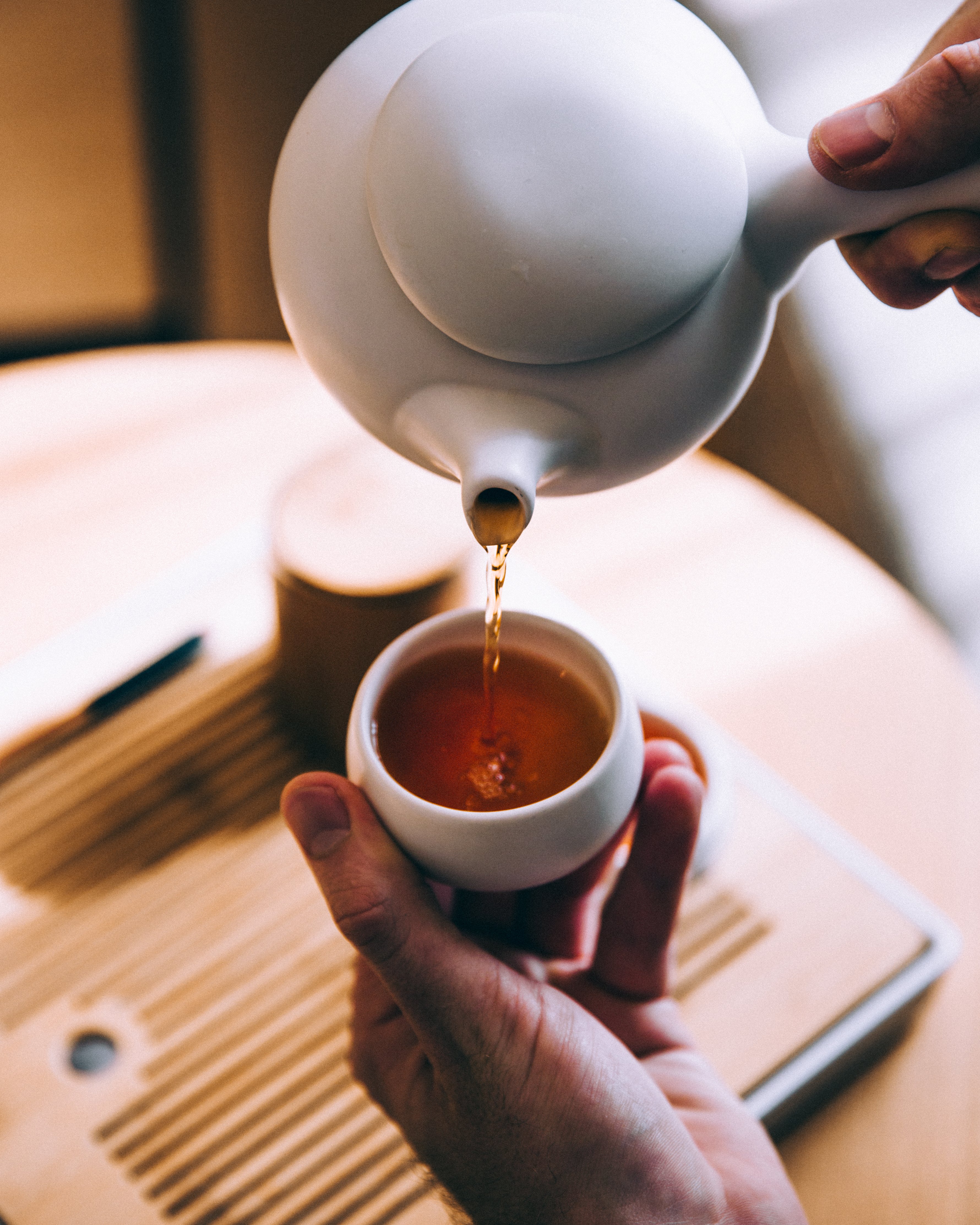 Hands Pouring Tea Royalty-Free Stock Photo and Image