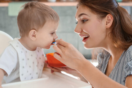 Mom Feeding Child