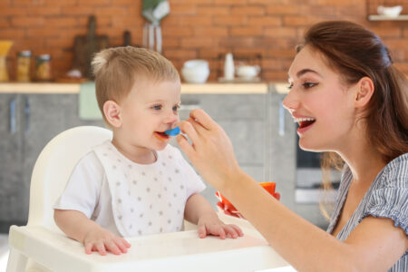 Mother Feeding Child