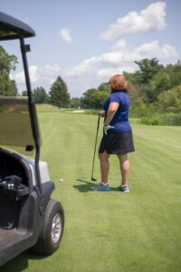 Woman Golfer Golfing